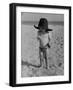 Little Boy at the Beach Wearing a Oversized Cowboy Hat Playing with a Toy Pistol-Ralph Crane-Framed Photographic Print
