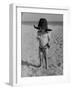 Little Boy at the Beach Wearing a Oversized Cowboy Hat Playing with a Toy Pistol-Ralph Crane-Framed Photographic Print