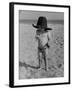 Little Boy at the Beach Wearing a Oversized Cowboy Hat Playing with a Toy Pistol-Ralph Crane-Framed Photographic Print