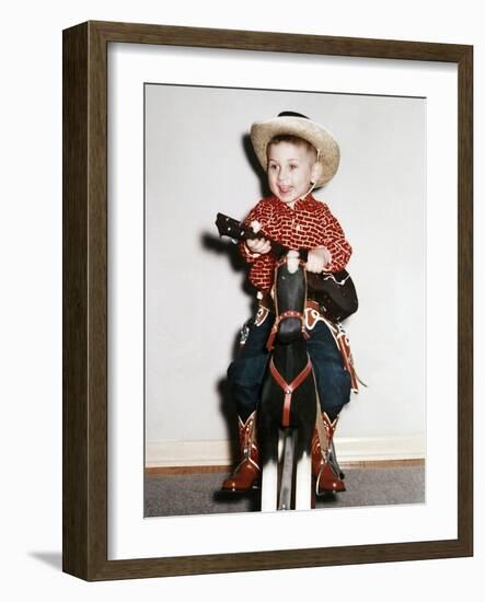 Little Boy Cowboy Plays Guitar While Riding His Horse, Ca. 1956-null-Framed Photographic Print