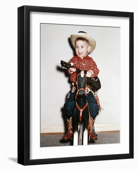 Little Boy Cowboy Plays Guitar While Riding His Horse, Ca. 1956-null-Framed Photographic Print