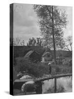 Little Boy Crossing the Bridge over the Stream at Winson Mill Farm, A War Nursery-Hans Wild-Stretched Canvas