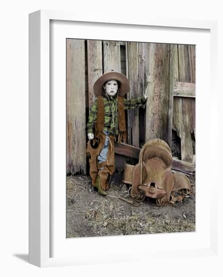 Little Boy Dressed as a Cowboy Standing Against a Barn with His Saddle on the Ground Next to Him-Nora Hernandez-Framed Giclee Print