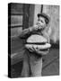 Little Boy Holding Loaves of Bread-Walter Sanders-Stretched Canvas