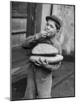 Little Boy Holding Loaves of Bread-Walter Sanders-Mounted Photographic Print