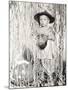 Little Boy in Halloween Costume Holding Mask Standing by Streamers-null-Mounted Photo