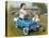Little Boy in Toy Car with Girl Leaning on it Outside Old Fashioned Diner-David Lindsley-Stretched Canvas