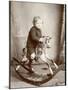 Little Boy on a Rocking Horse-null-Mounted Photographic Print