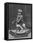 Little Boy on a Very Small Rocking Horse with a Whip in His Hand-null-Framed Stretched Canvas