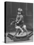 Little Boy on a Very Small Rocking Horse with a Whip in His Hand-null-Stretched Canvas