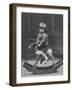 Little Boy on a Very Small Rocking Horse with a Whip in His Hand-null-Framed Photographic Print