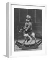 Little Boy on a Very Small Rocking Horse with a Whip in His Hand-null-Framed Photographic Print