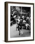 Little Boy on Merry Go Round at the Tuileries Gardens, Sticking Out His Tongue-Alfred Eisenstaedt-Framed Photographic Print
