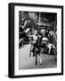 Little Boy on Merry Go Round at the Tuileries Gardens, Sticking Out His Tongue-Alfred Eisenstaedt-Framed Photographic Print