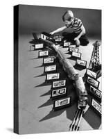 Little Boy Playing with a Toy Train and Billboard Set-Walter Sanders-Stretched Canvas