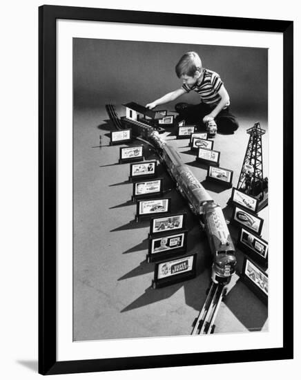 Little Boy Playing with a Toy Train and Billboard Set-Walter Sanders-Framed Photographic Print