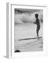 Little Boy Standing on a Surf Board Staring at the Water-Allan Grant-Framed Photographic Print