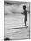 Little Boy Standing on a Surf Board Staring at the Water-Allan Grant-Mounted Photographic Print