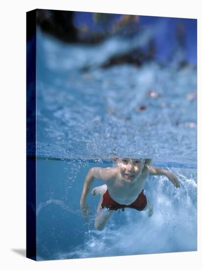 Little Boy Swimming Underwater-James Gritz-Stretched Canvas