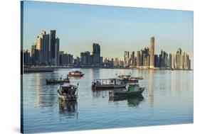 Little fishing boats and the skyline of Panama City, Panama, Central America-Michael Runkel-Stretched Canvas