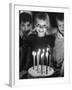 Little Girl Blowing Out Her Candles on Her Birthday Cake-Robert W^ Kelley-Framed Photographic Print