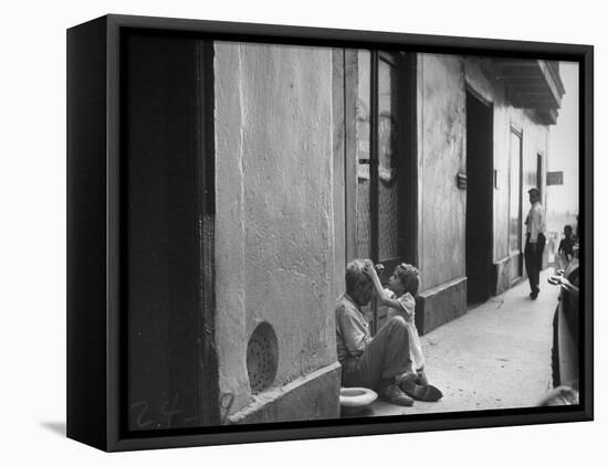 Little Girl Cleaning Face of a Street Beggar-null-Framed Stretched Canvas