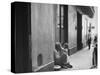 Little Girl Cleaning Face of a Street Beggar-null-Stretched Canvas