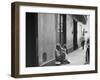 Little Girl Cleaning Face of a Street Beggar-null-Framed Photographic Print