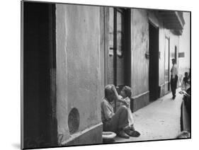 Little Girl Cleaning Face of a Street Beggar-null-Mounted Photographic Print
