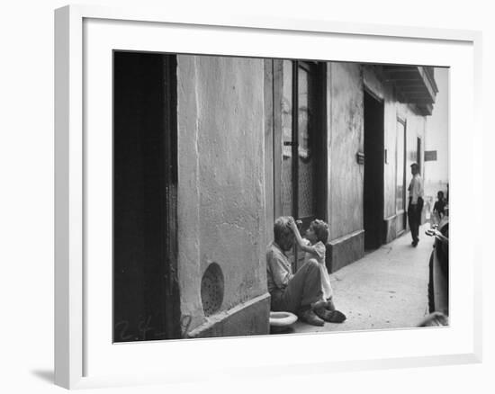 Little Girl Cleaning Face of a Street Beggar-null-Framed Photographic Print