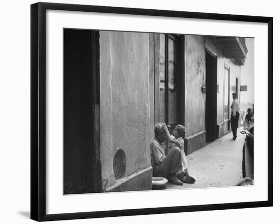 Little Girl Cleaning Face of a Street Beggar-null-Framed Photographic Print