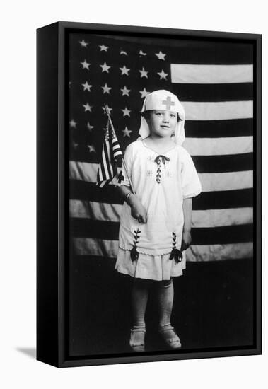 Little Girl in Nurses Outfit Holding US Flag-Lantern Press-Framed Stretched Canvas