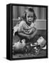 Little Girl Leaning over Her Broken Piggy Bank-Nina Leen-Framed Stretched Canvas