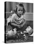Little Girl Leaning over Her Broken Piggy Bank-Nina Leen-Stretched Canvas