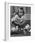Little Girl Leaning over Her Broken Piggy Bank-Nina Leen-Framed Photographic Print