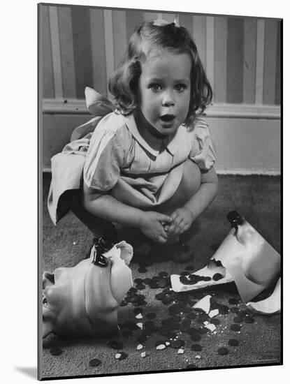 Little Girl Leaning over Her Broken Piggy Bank-Nina Leen-Mounted Photographic Print