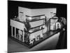 Little Girl Looking Into a Modern Doll House Being Sold at F.A.O. Schwarz-Herbert Gehr-Mounted Photographic Print