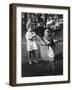 Little Girl Pushes Her Teddy Bear Around in a Pram-null-Framed Photographic Print