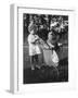 Little Girl Pushes Her Teddy Bear Around in a Pram-null-Framed Photographic Print