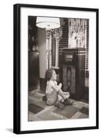 Little Girl Smiles as She Enjoys a Radio Program in the 1930s-null-Framed Photo