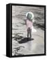 Little Girl Standing at Edge of Water with Pail over Her Head-Nora Hernandez-Framed Stretched Canvas