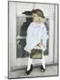 Little Girl Wearing Had and Holding Purse Standing in Front of a Door-Nora Hernandez-Mounted Giclee Print