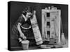 Little Girl with a Toy House Cleaning Kit-Walter Sanders-Stretched Canvas