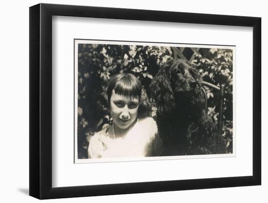 Little Girl with Black Spaniel Dog-null-Framed Photographic Print