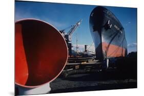 Little Rock Oil Tanker over Ship Ventilator Parts at Sun Shipbuilding and Dry Dock Co. Shipyards-Dmitri Kessel-Mounted Premium Photographic Print