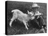 Little White Goat Being Fed from Bottle by Little Boy, at White Horse Ranch-William C^ Shrout-Stretched Canvas