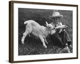 Little White Goat Being Fed from Bottle by Little Boy, at White Horse Ranch-William C^ Shrout-Framed Photographic Print