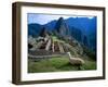 Llama Rests Overlooking Ruins of Machu Picchu in the Andes Mountains, Peru-Jim Zuckerman-Framed Premium Photographic Print