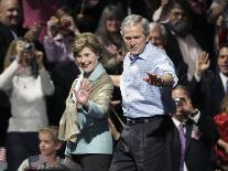 President Bush, Right, and First Lady Laura Bush Arrive for a Rally for Texas Governor Rick Perry-Lm Otero-Premium Photographic Print