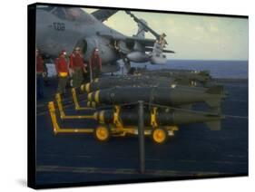 Loading Bombs onto US Navy A-6 Intruder Plane on Board Aircraft Carrier, in Mediterranean Sea-null-Stretched Canvas
